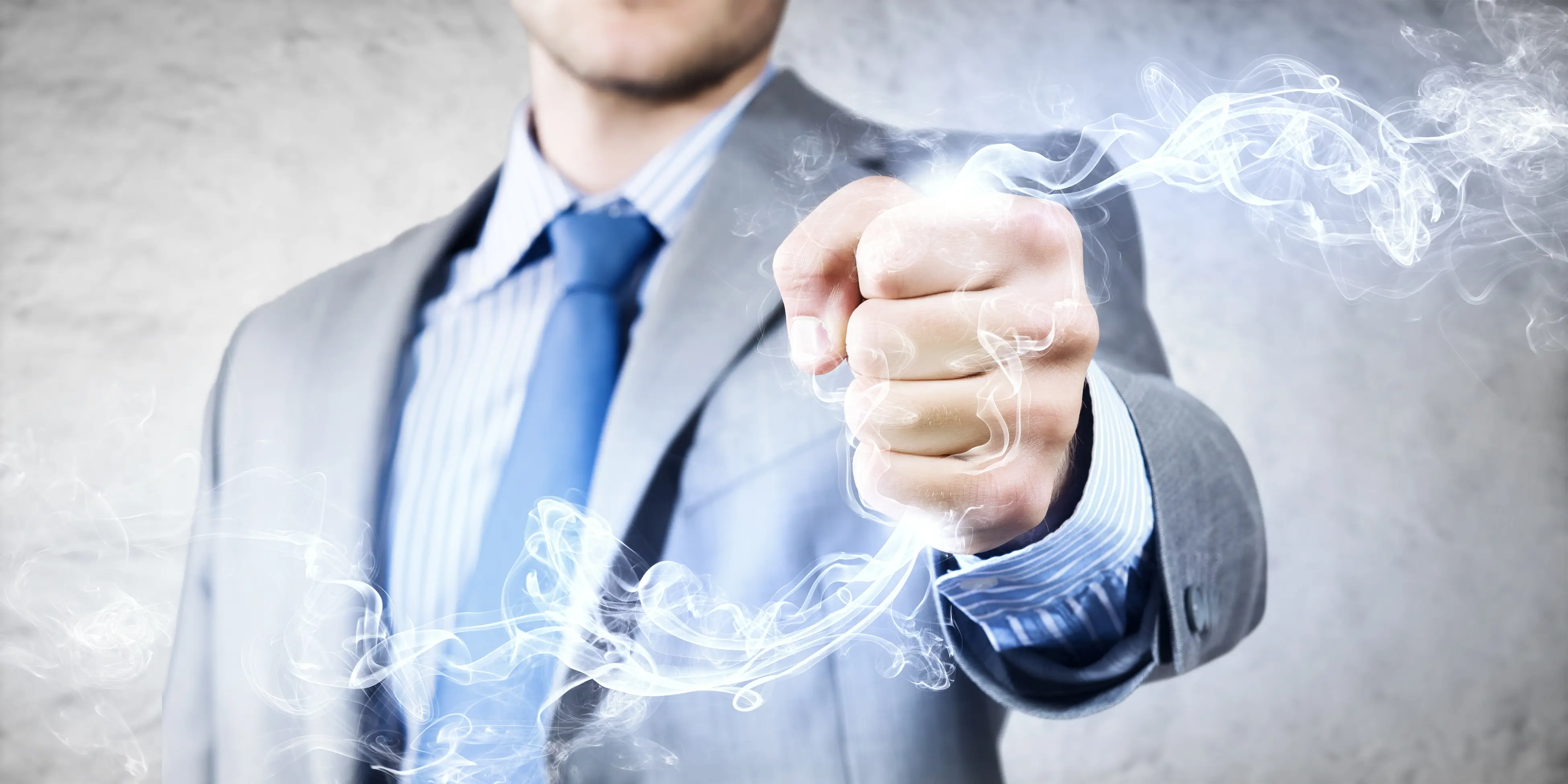 Close up image of businessman clenching fume in fist