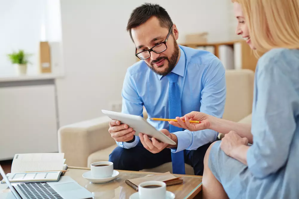 Woman asking questions to sales manager